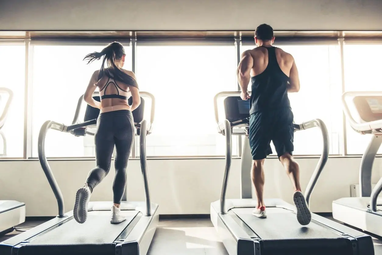 Young People Running on Treadmill